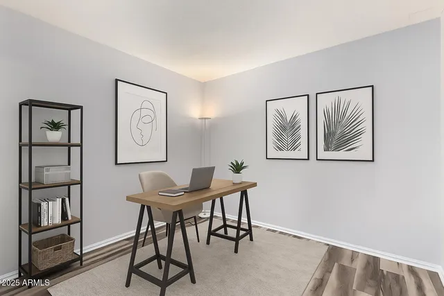 a workspace with furniture and window