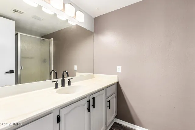 a bathroom with a sink and a mirror