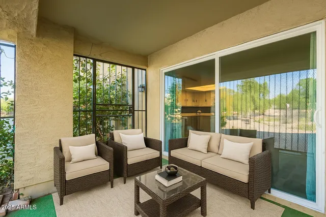 a living room with furniture and a large window