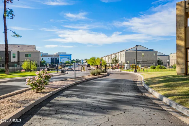 a view of multiple houses with a swimming pool