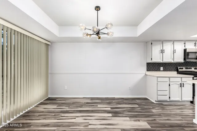 a view of a kitchen with a sink and dishwasher