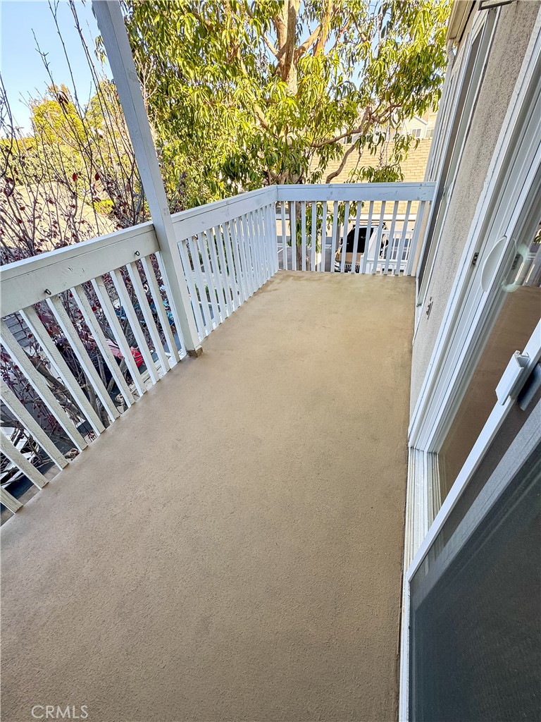 34110 Selva Road, Unit 323 Dana Point, CA 92629 - Photo 15 of 21 a view of balcony and wooden floor
