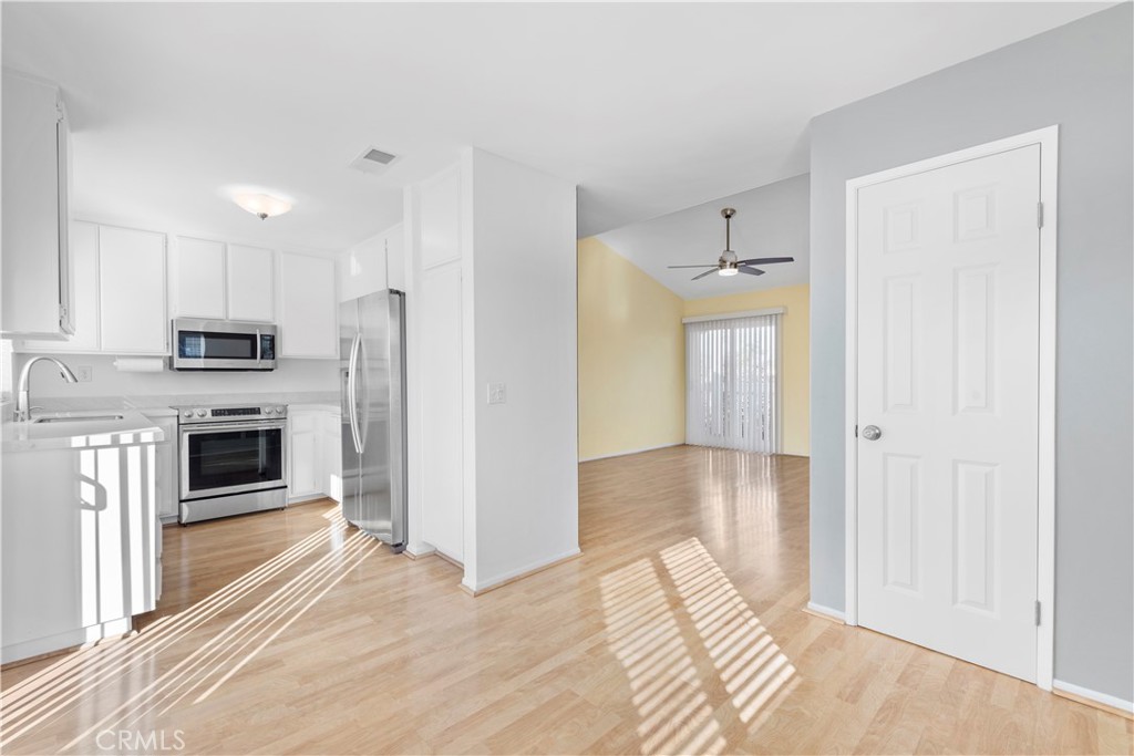 34110 Selva Road, Unit 323 Dana Point, CA 92629 - Photo 9 of 18 a view of a kitchen with refrigerator and an oven