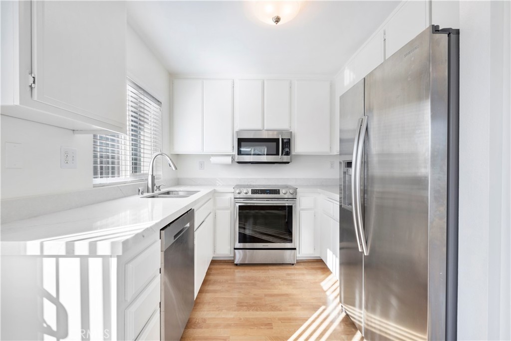 34110 Selva Road, Unit 323 Dana Point, CA 92629 - Photo 10 of 18 a kitchen with a sink stove and refrigerator