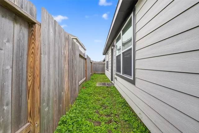 a view of a back yard of the house
