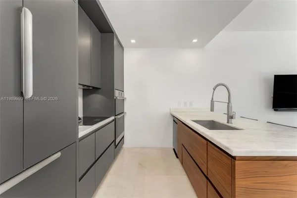 a kitchen with a sink and a microwave