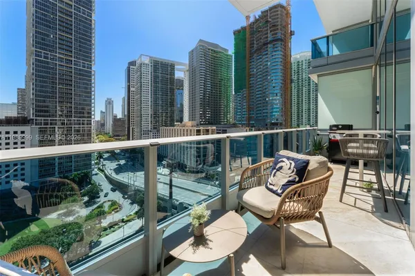 a view of a balcony with chairs