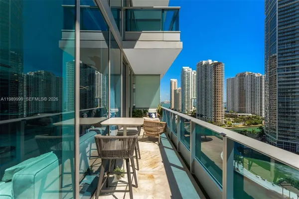 a balcony with chairs