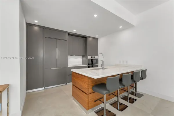 a kitchen with a table and chairs