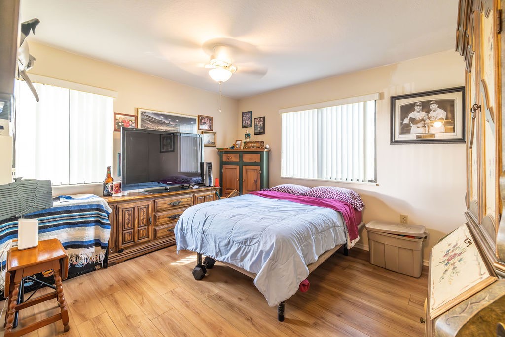 5740 Marina Drive, Unit 2 Sebastian, FL 32958 - Photo 12 of 24 a spacious bedroom with a bed and a flat screen tv