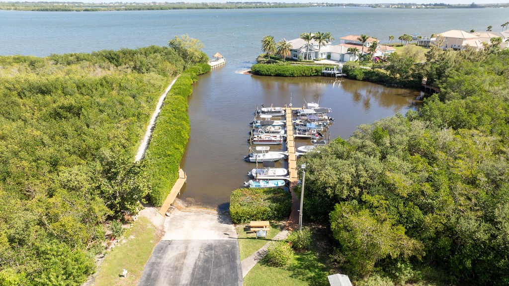 5740 Marina Drive, Unit 2 Sebastian, FL 32958 - Photo 17 of 24 a view of a lake with a building in the background