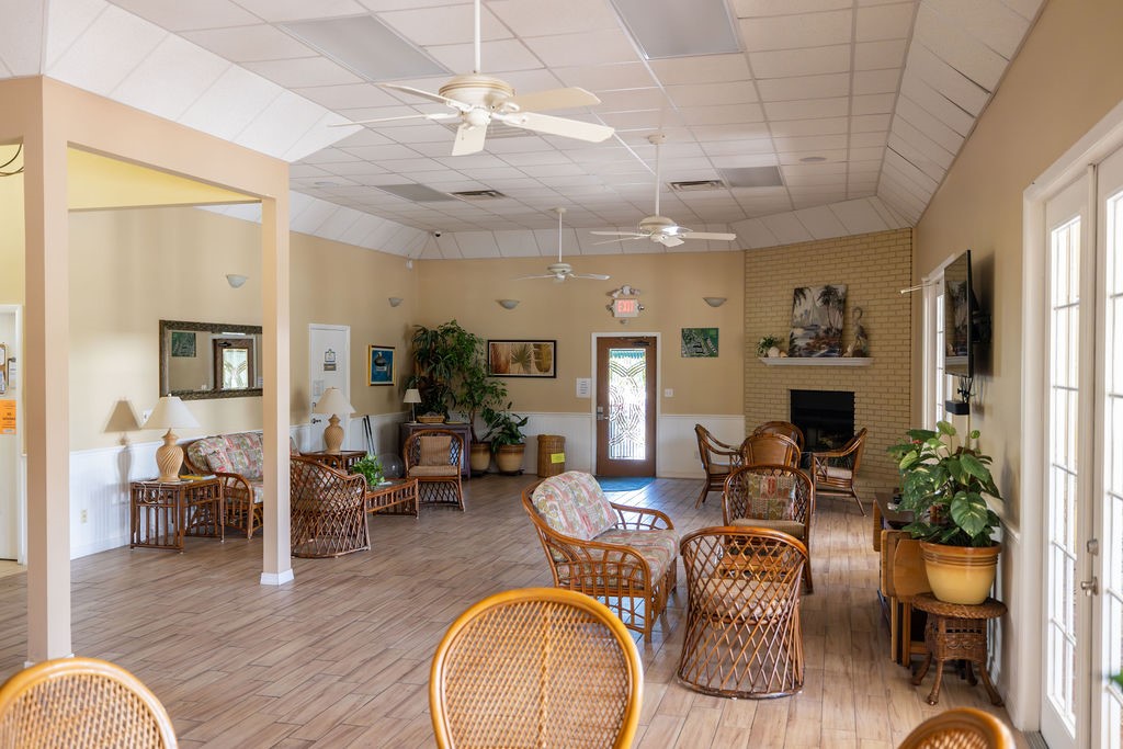 5740 Marina Drive, Unit 2 Sebastian, FL 32958 - Photo 20 of 24 a living room with furniture potted plant and a fireplace