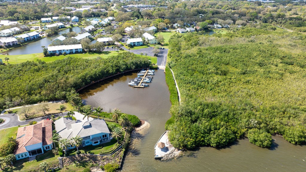 5740 Marina Drive, Unit 2 Sebastian, FL 32958 - Photo 23 of 24 an aerial view of residential house with outdoor space and trees all around