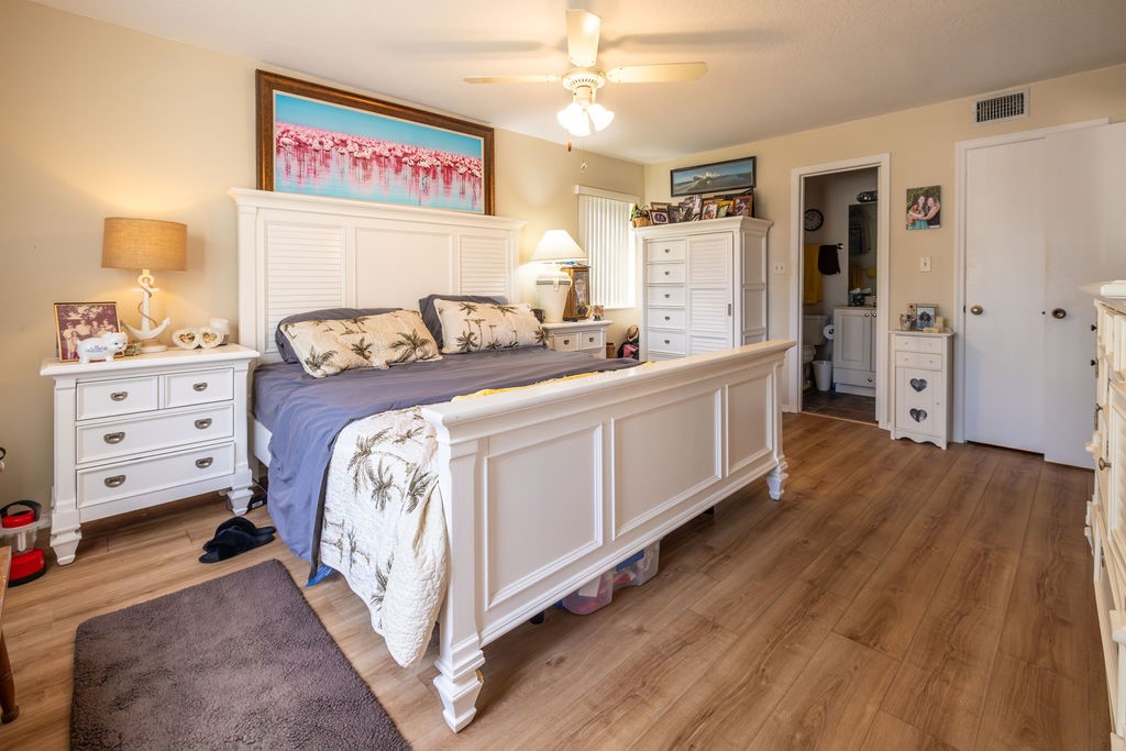 5740 Marina Drive, Unit 2 Sebastian, FL 32958 - Photo 9 of 24 a view of a bedroom with bed and wooden floor