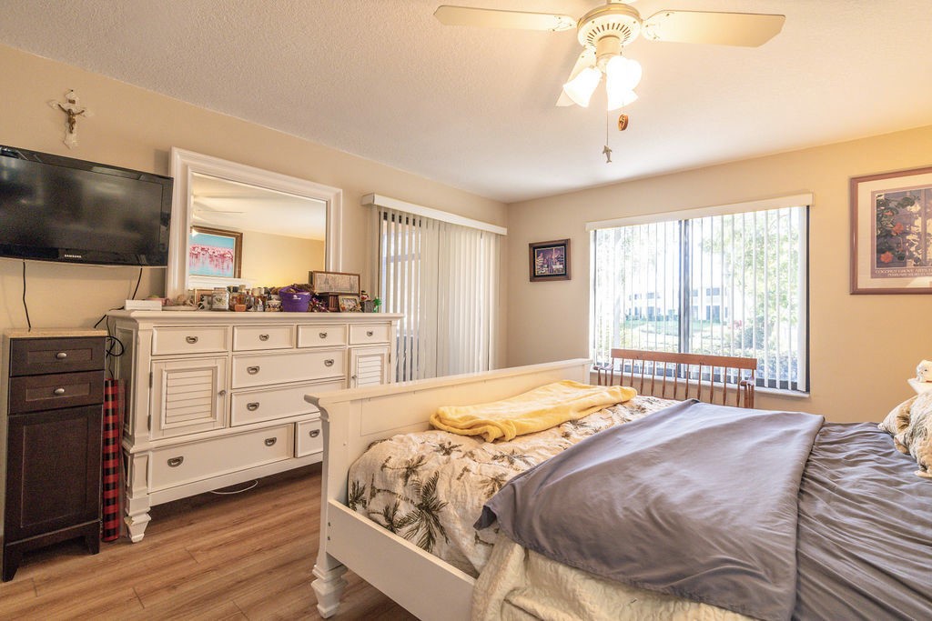 5740 Marina Drive, Unit 2 Sebastian, FL 32958 - Photo 10 of 24 a bedroom with a bed and a flat screen tv