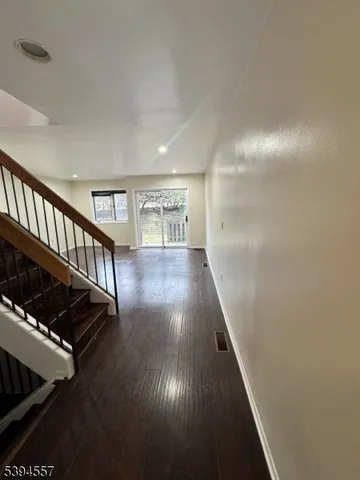 a view of entryway with wooden floor