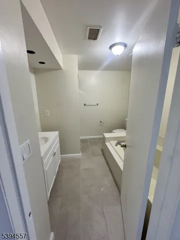 a bathroom with a sink and toilet