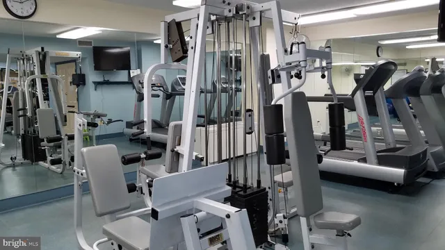 a room with pool table and windows