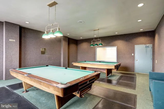 a view of swimming pool with outdoor seating