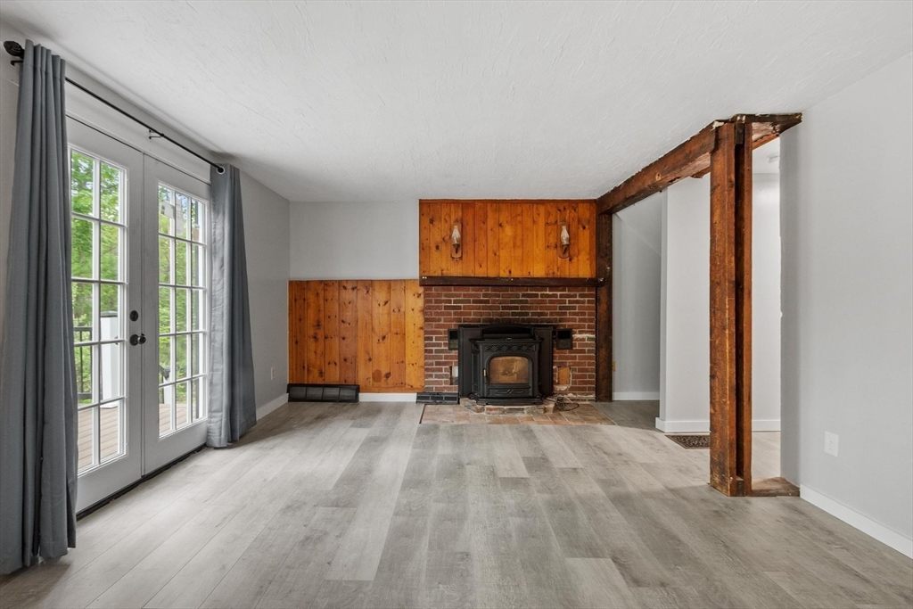258 Allen Road Ashby, MA 01431 - Photo 14 of 36 a view of empty room with a fireplace and window