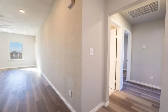 a view of kitchen with sink microwave and stove top oven