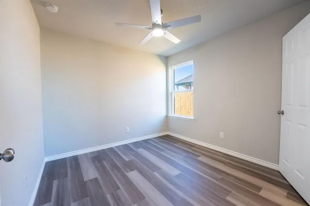 a bathroom with a granite countertop sink a toilet and bathtub