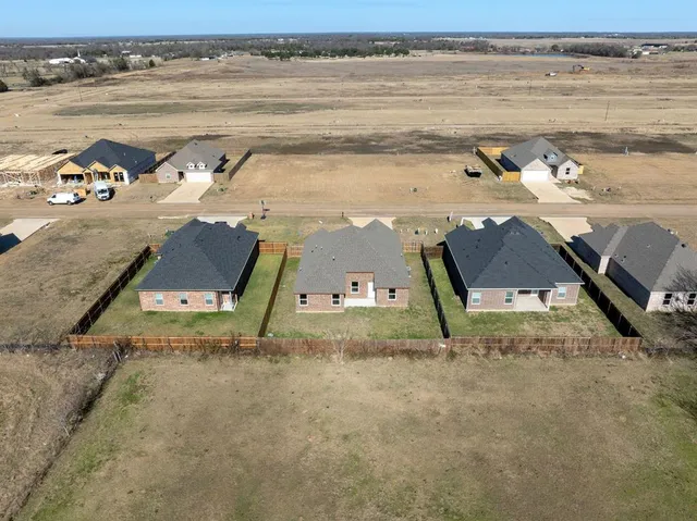 an aerial view of a house with swimming pool