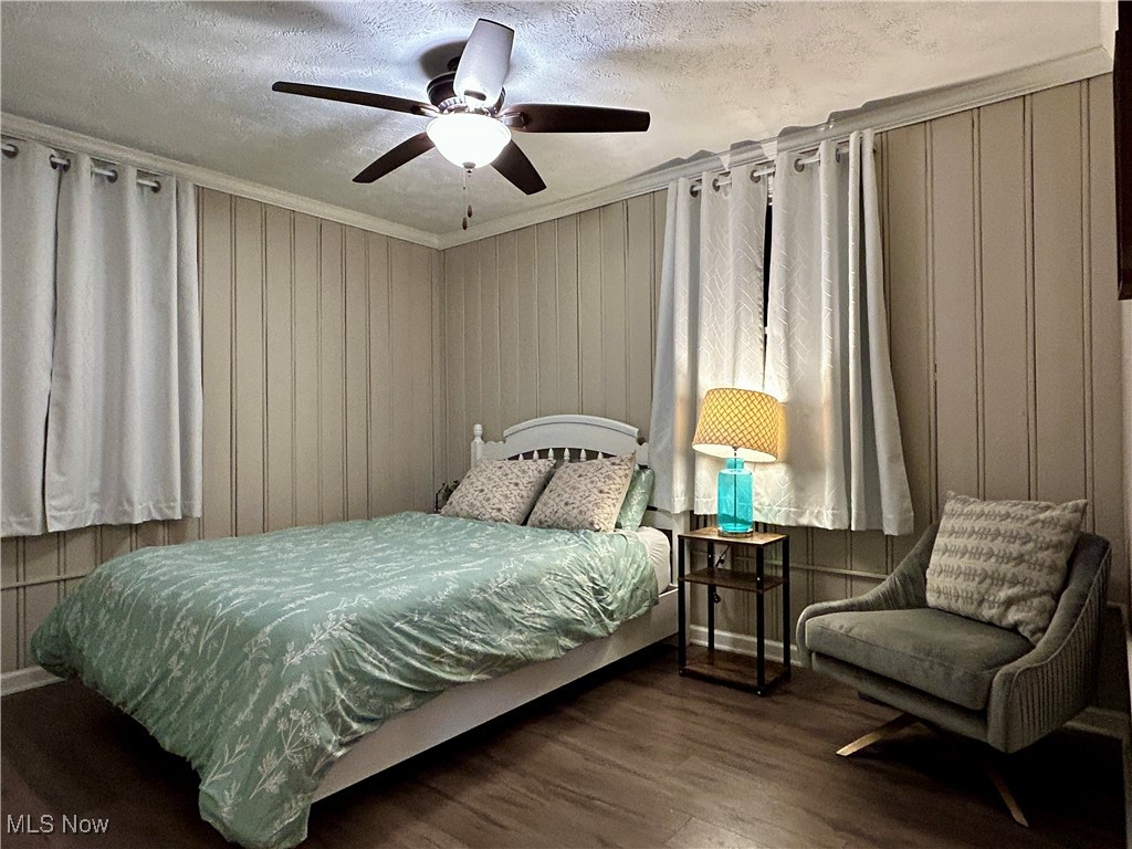 364 Erie Road Vermilion, OH 44089 - Photo 15 of 20 Bedroom with dark wood-style flooring, a textured ceiling, and ceiling fan