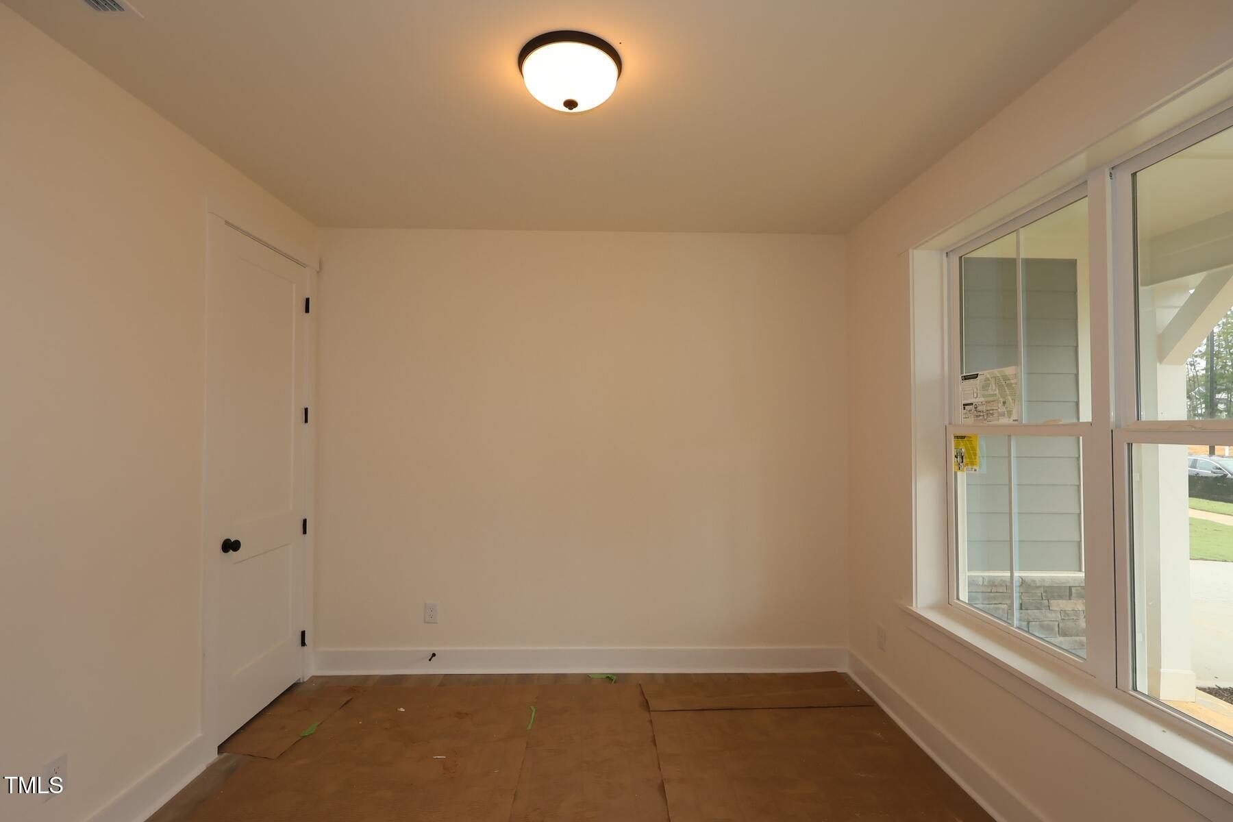1124 Opal Lane, Unit 88 Durham, NC 27705 - Photo 12 of 27 an empty room with a window