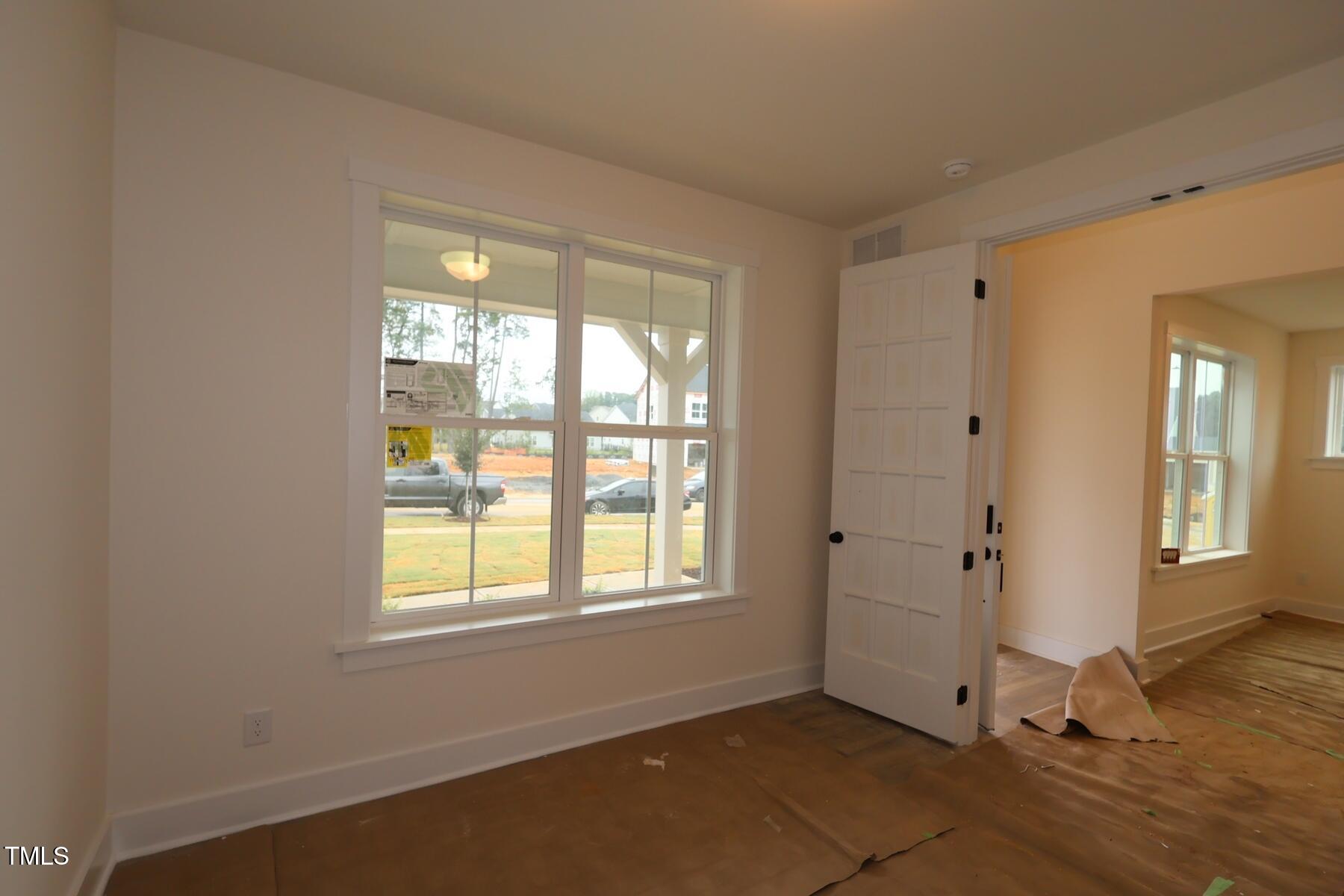 1124 Opal Lane, Unit 88 Durham, NC 27705 - Photo 13 of 27 an empty room with windows