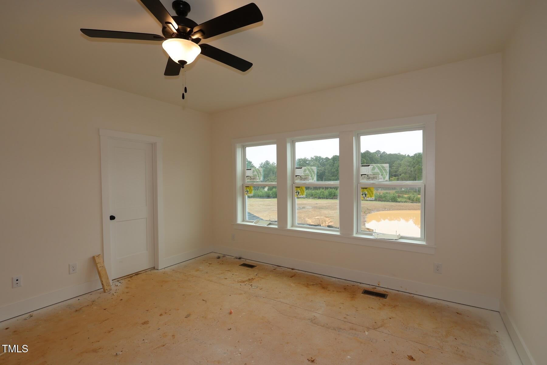 1124 Opal Lane, Unit 88 Durham, NC 27705 - Photo 18 of 27 a view of an empty room with a window