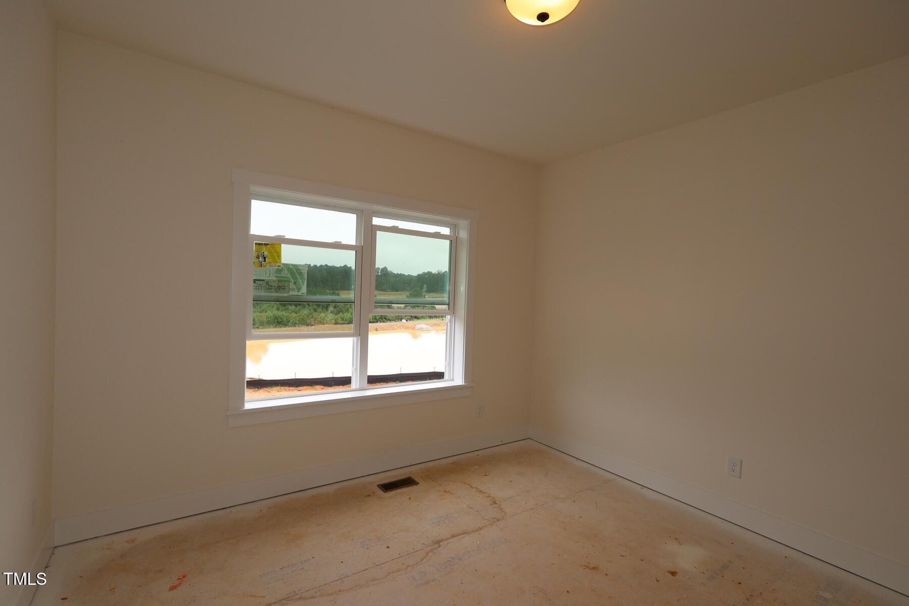 1124 Opal Lane, Unit 88 Durham, NC 27705 - Photo 22 of 27 an empty room with a window
