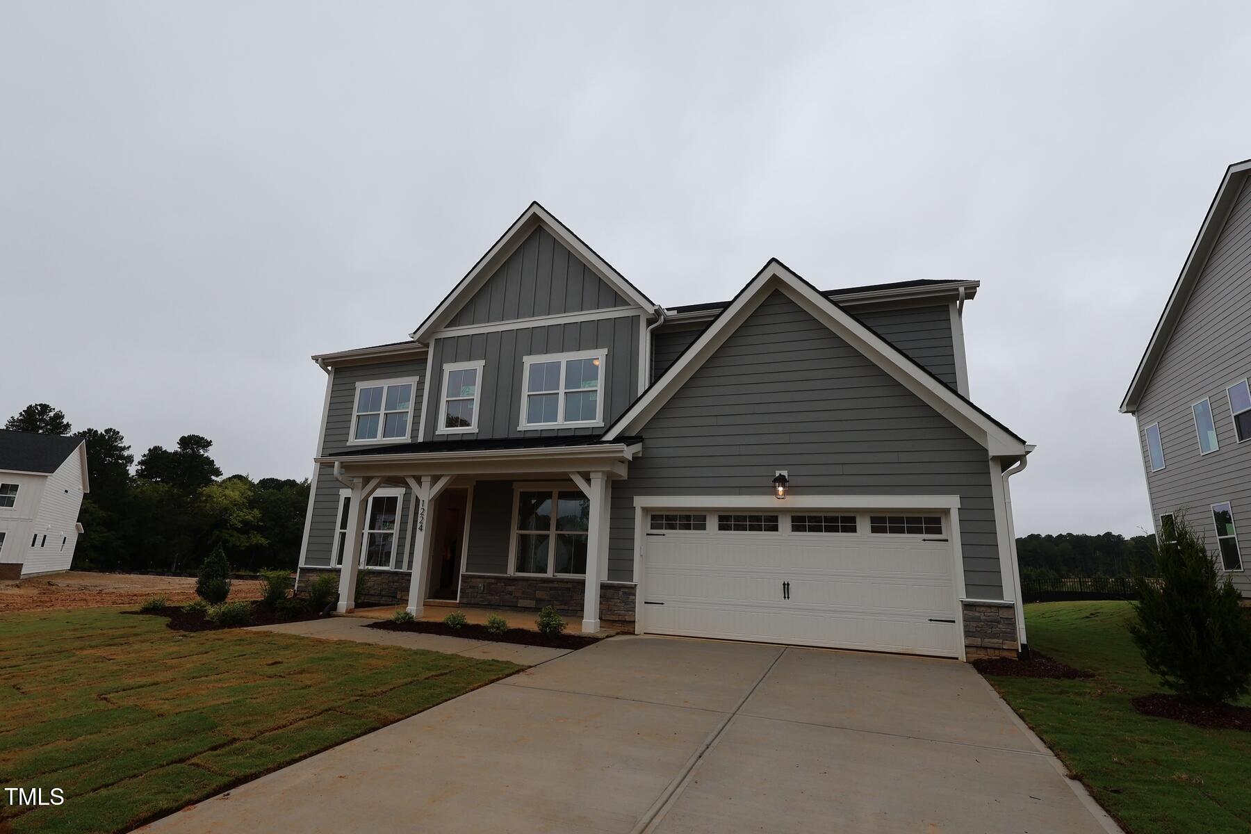 1124 Opal Lane, Unit 88 Durham, NC 27705 - Photo 4 of 27 a front view of a house with yard