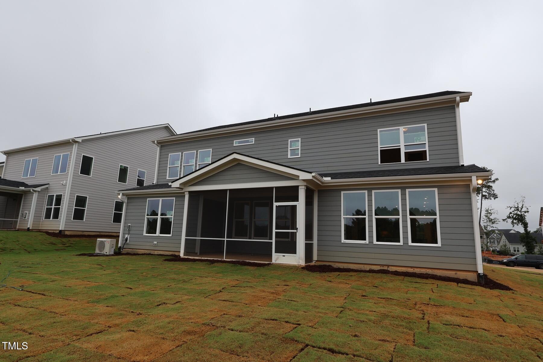1124 Opal Lane, Unit 88 Durham, NC 27705 - Photo 5 of 27 a front view of a house with a garden