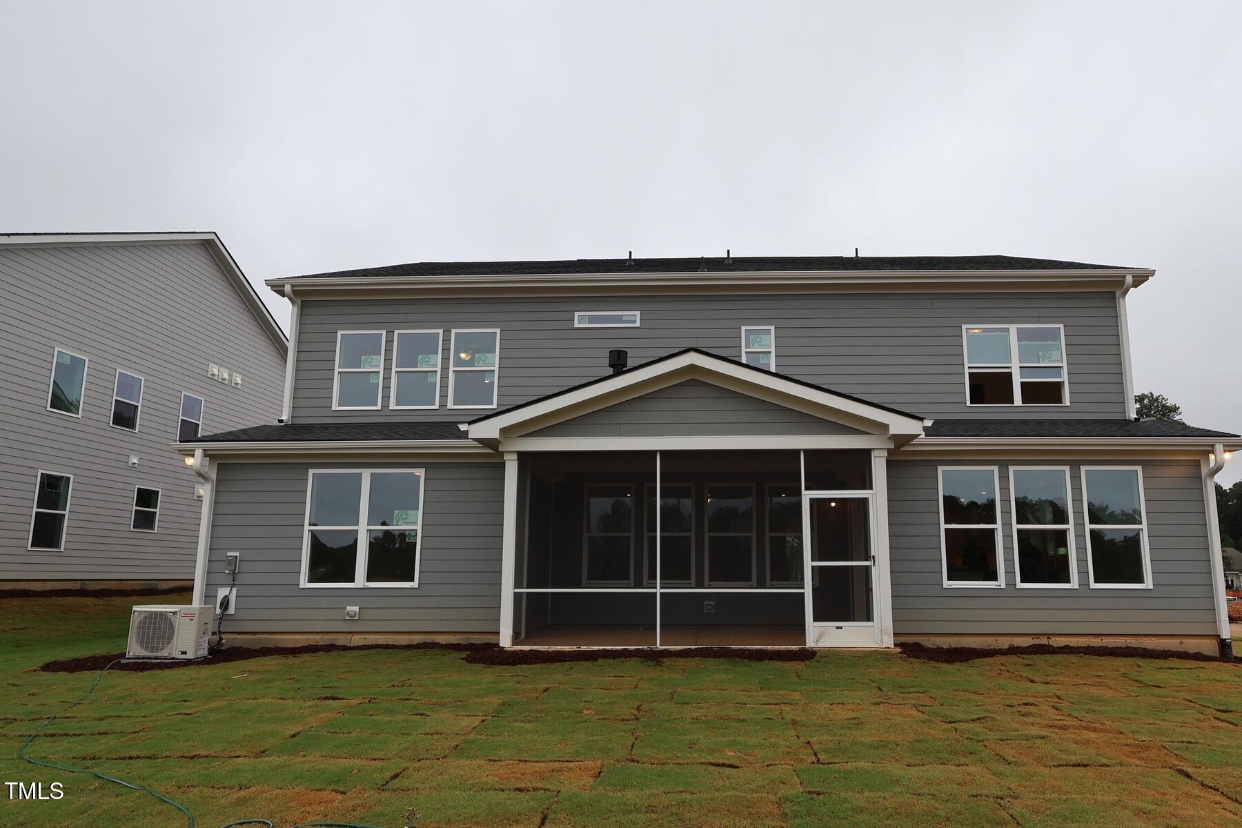 1124 Opal Lane, Unit 88 Durham, NC 27705 - Photo 6 of 27 a front view of a house with a yard