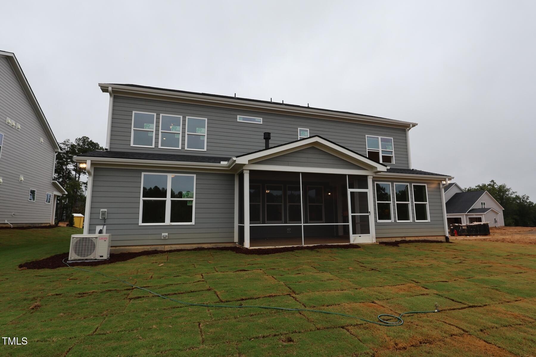 1124 Opal Lane, Unit 88 Durham, NC 27705 - Photo 7 of 27 a front view of a house with a yard