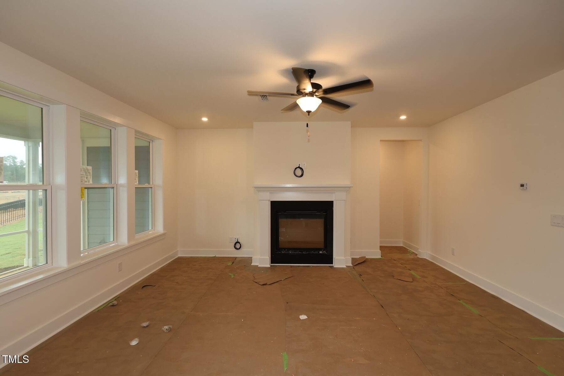 1124 Opal Lane, Unit 88 Durham, NC 27705 - Photo 8 of 27 a view of empty room with a fireplace