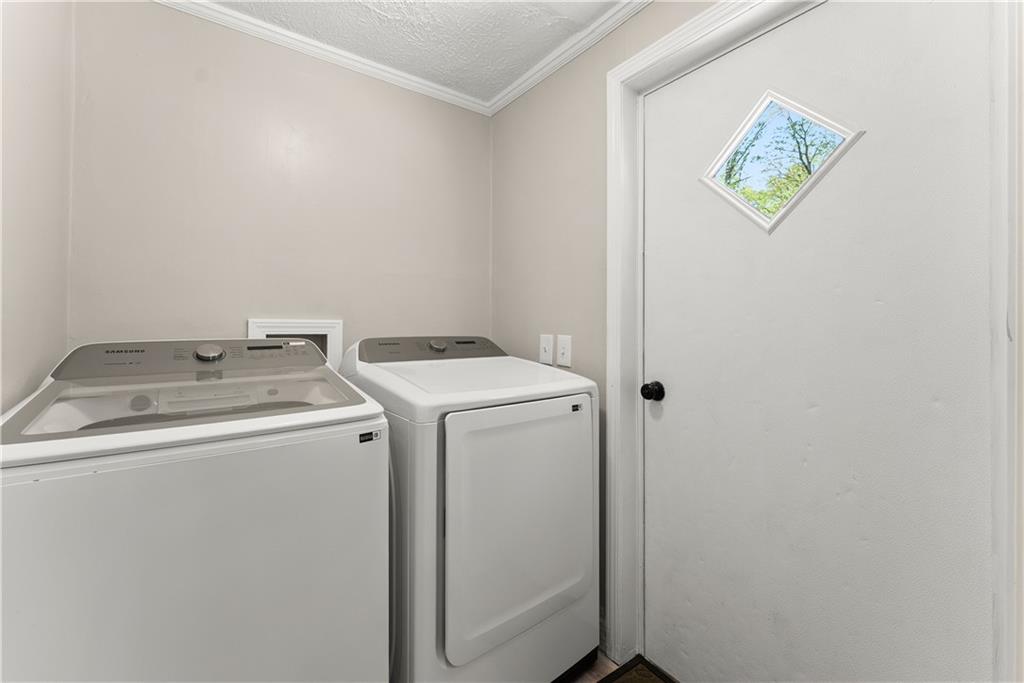 1670 Azelea Lane Gainesville, GA 30507 - Photo 11 of 33 a utility room with dryer and washer