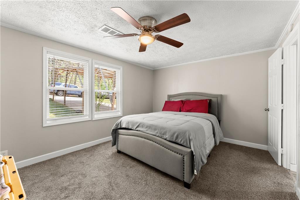 1670 Azelea Lane Gainesville, GA 30507 - Photo 12 of 33 a spacious bedroom with a bed and window