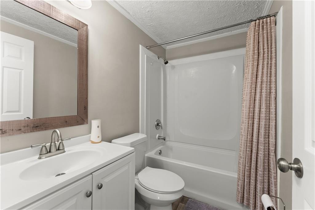 1670 Azelea Lane Gainesville, GA 30507 - Photo 18 of 33 a bathroom with a sink toilet and shower