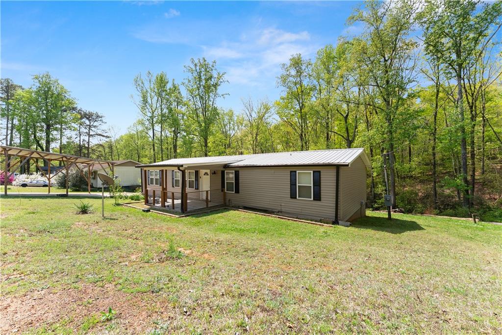 1670 Azelea Lane Gainesville, GA 30507 - Photo 2 of 33 a view of a house with a yard and sitting area