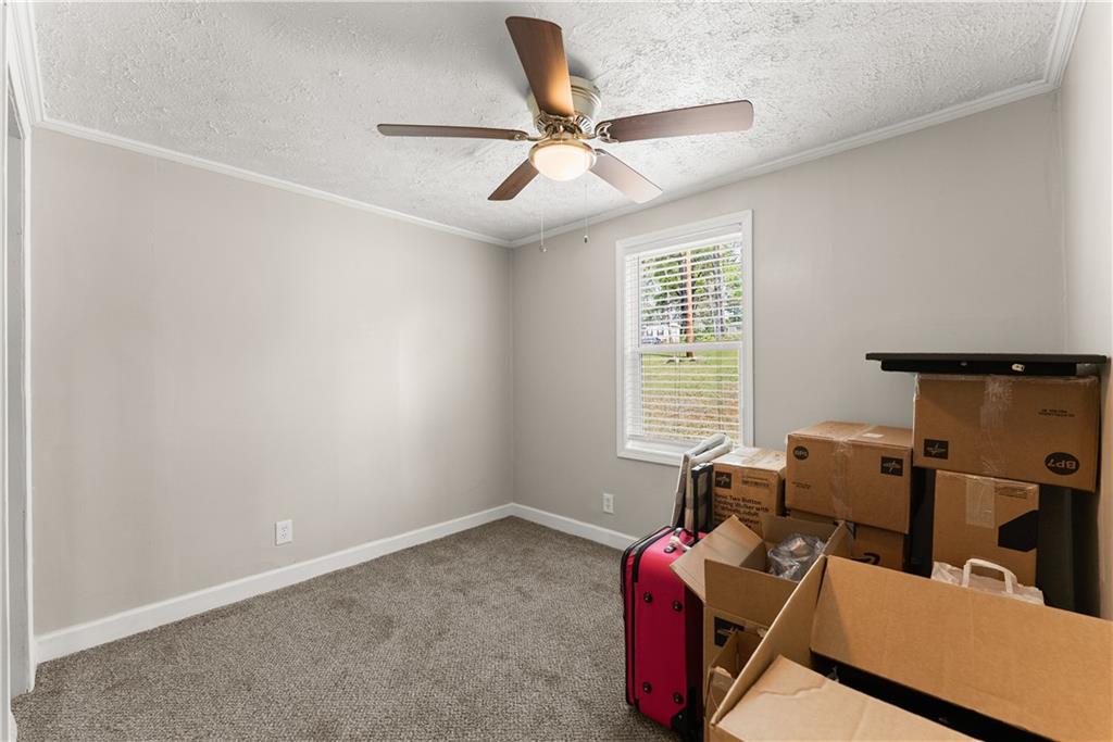 1670 Azelea Lane Gainesville, GA 30507 - Photo 24 of 33 a living room with furniture and a window