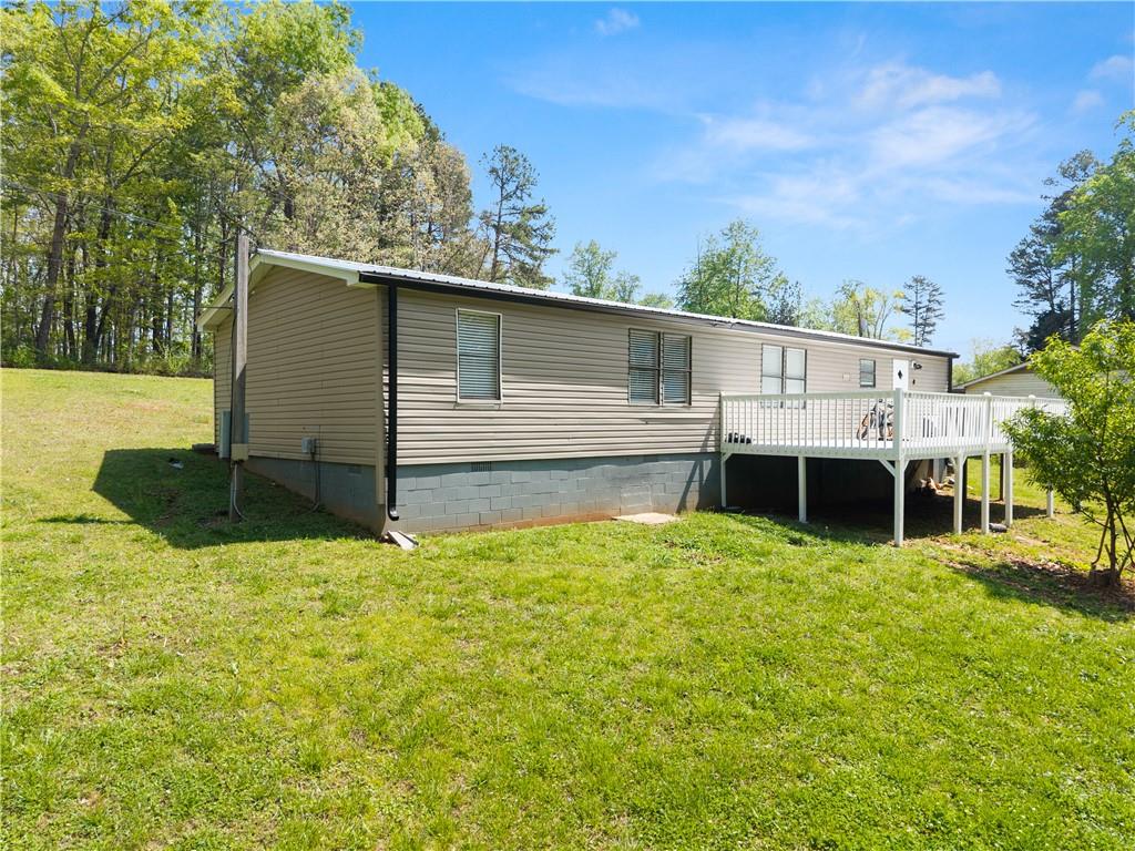 1670 Azelea Lane Gainesville, GA 30507 - Photo 28 of 33 a view of house with backyard and trees