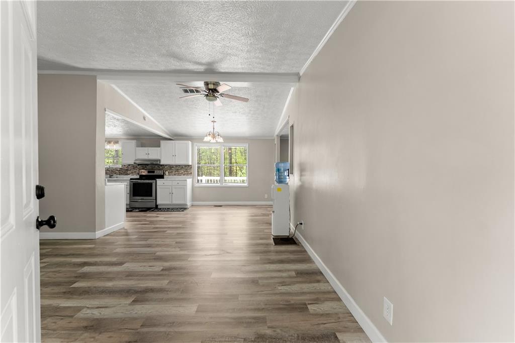 1670 Azelea Lane Gainesville, GA 30507 - Photo 4 of 33 a view of a kitchen with a sink and a refrigerator