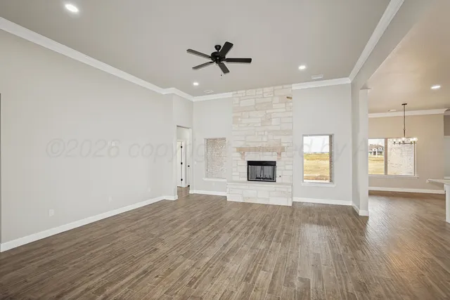 wooden floor in an empty room with a fireplace