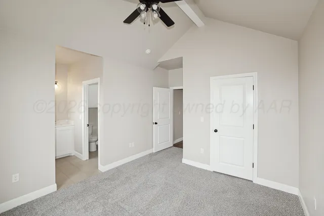 a view of a livingroom with a ceiling fan & entryway