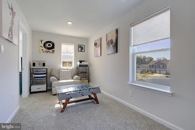a room with furniture and white walls