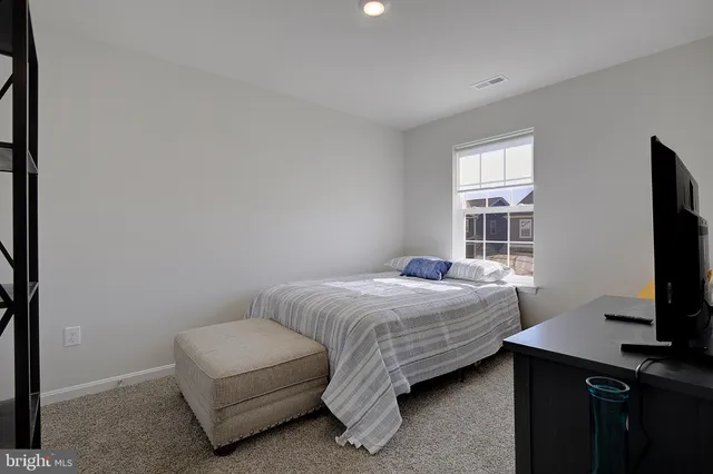 a bathroom with a sink a toilet and shower curtain