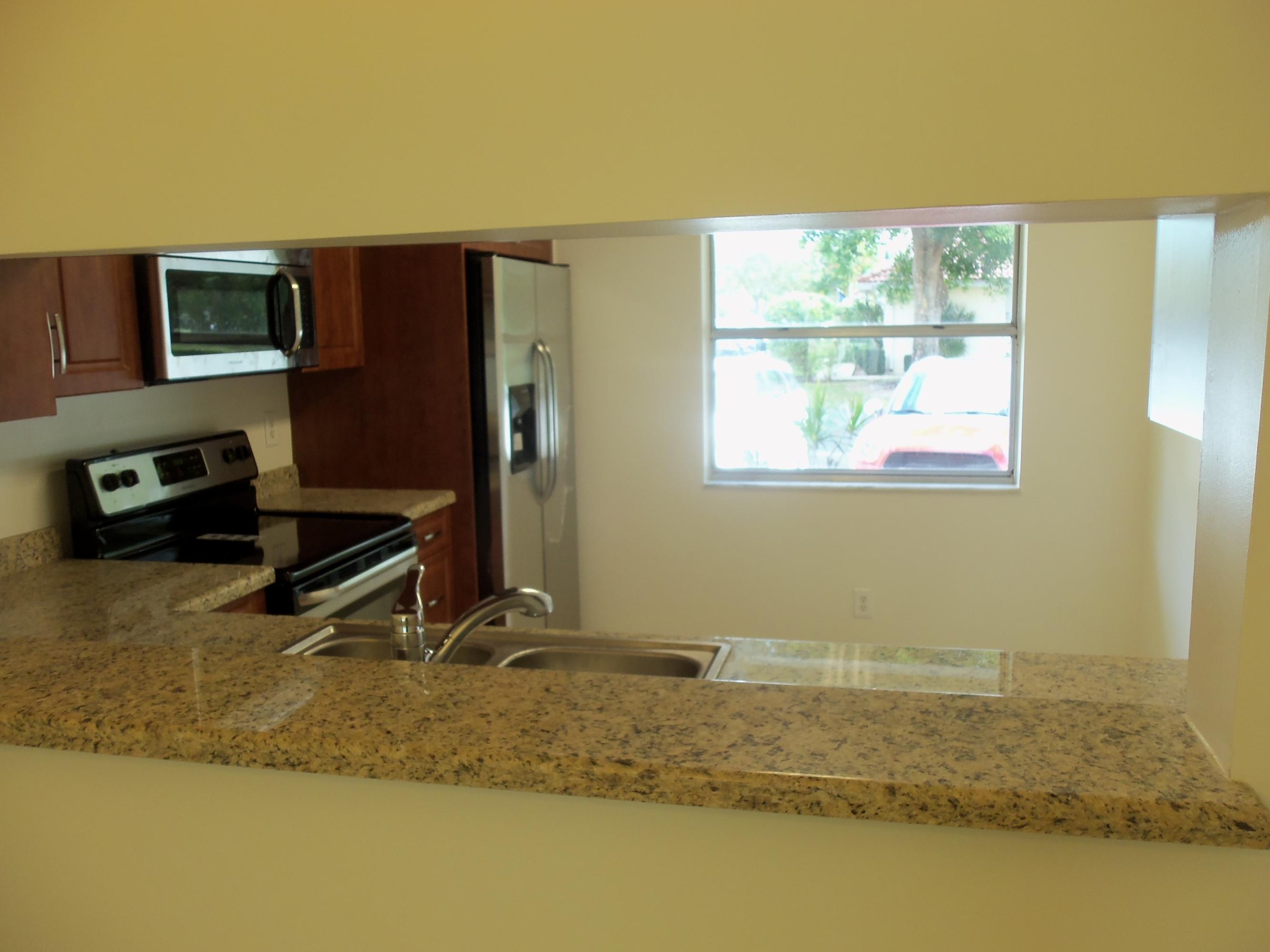 6429 Boca Circle Boca Raton, FL 33433 - Photo 8 of 27 KITCHEN PASS THROUGH FROM DINING AREA