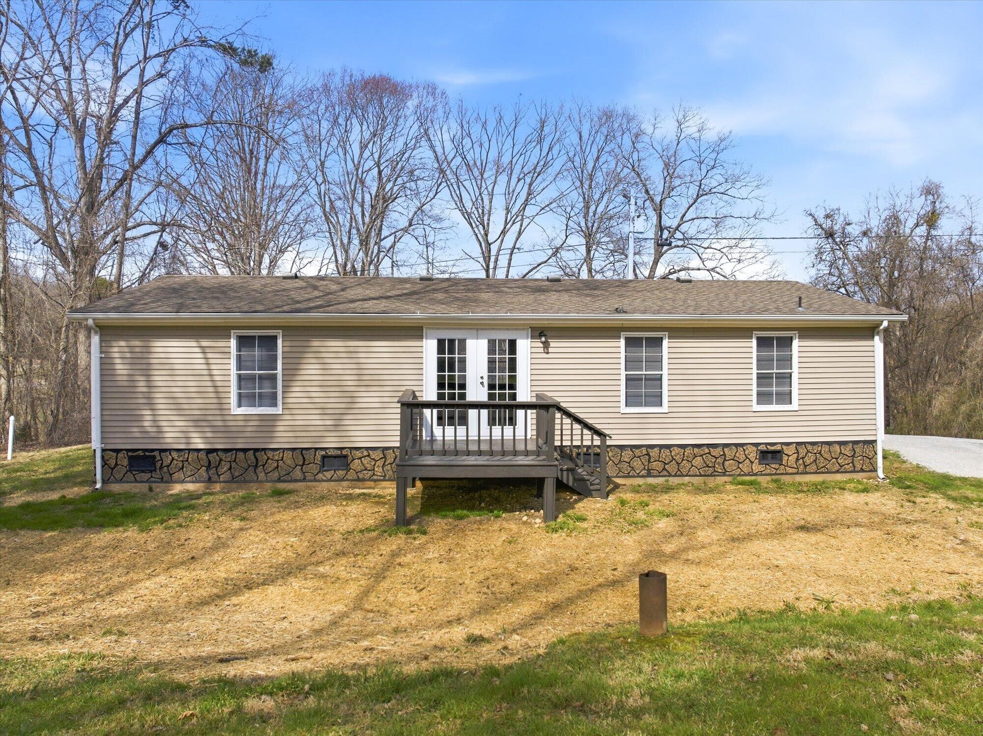 64 County Road 100 Decatur, TN 37322 - Photo 23 of 43 a front view of a house with a yard
